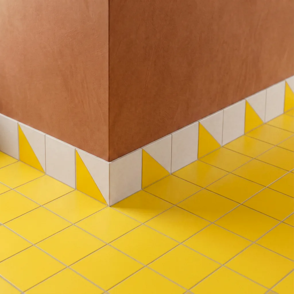 Azulejo Trigone Blanco 10x10 Amarillo Brillo colocado como cenefa en un suelo