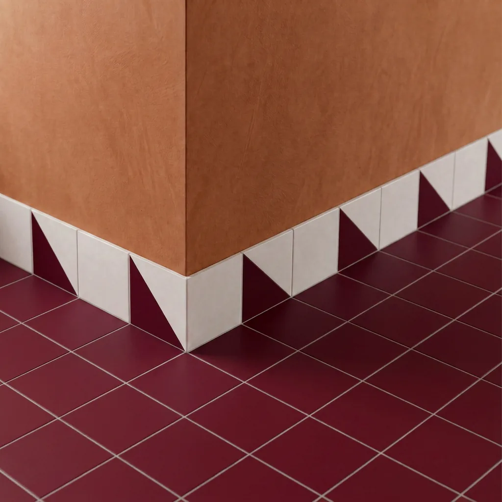 Azulejo Trigone Blanco 10x10 Burdeos Brillo colocado como cenefa en un suelo